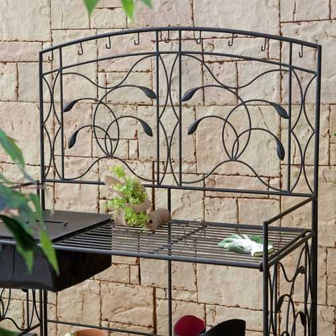 Image of Black Metal Potting Bench with Wrought Iron Vine Details and Fabric Potting Sink